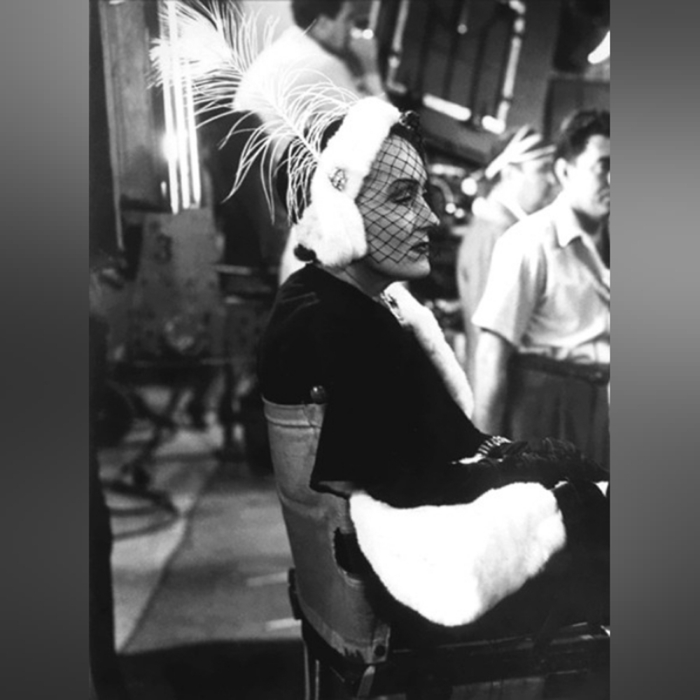 The Witch Wears An Elegant Black and White Feathered Hair Accessory